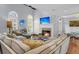 Relaxing living room featuring a large sectional sofa and a beautiful fireplace at 3427 Colonel Vanderhorst Cir, Mount Pleasant, SC 29466