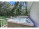 Relax in this outdoor hot tub, nestled on a deck overlooking a lush green backyard at 3427 Colonel Vanderhorst Cir, Mount Pleasant, SC 29466