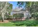 Charming white house with a large front porch and lush landscaping at 3427 Colonel Vanderhorst Cir, Mount Pleasant, SC 29466