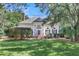 White house with a large front porch, columns, and lush landscaping at 3427 Colonel Vanderhorst Cir, Mount Pleasant, SC 29466