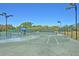 Well-lit tennis court with surrounding fence at 3427 Colonel Vanderhorst Cir, Mount Pleasant, SC 29466