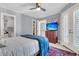 Bright bedroom with double doors, built-in shelving and en-suite bathroom at 3427 Colonel Vanderhorst Cir, Mount Pleasant, SC 29466