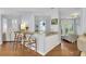 Breakfast bar with two stools, granite countertop, and access to the living room at 3427 Colonel Vanderhorst Cir, Mount Pleasant, SC 29466