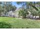 White house with a large patio, mature trees, and a spacious backyard at 3427 Colonel Vanderhorst Cir, Mount Pleasant, SC 29466