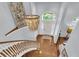 Elegant staircase with wood railings and a beautiful chandelier at 3427 Colonel Vanderhorst Cir, Mount Pleasant, SC 29466