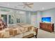Spacious bedroom with large windows, TV and a cozy bed at 3427 Colonel Vanderhorst Cir, Mount Pleasant, SC 29466