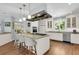 Kitchen island with seating, granite countertops, and stainless steel appliances at 3427 Colonel Vanderhorst Cir, Mount Pleasant, SC 29466