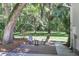 Brick patio with seating area, fire pit, and lush landscaping at 3427 Colonel Vanderhorst Cir, Mount Pleasant, SC 29466