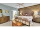 Primary bedroom with brick feature wall and ensuite bathroom access at 3427 Colonel Vanderhorst Cir, Mount Pleasant, SC 29466