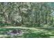 Private wooded backyard with a tree stump at 3427 Colonel Vanderhorst Cir, Mount Pleasant, SC 29466