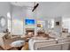 Spacious living room with a cozy fireplace and ample natural light at 3427 Colonel Vanderhorst Cir, Mount Pleasant, SC 29466