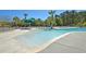 Community pool with a sandy beach entry and lounge chairs at 3427 Colonel Vanderhorst Cir, Mount Pleasant, SC 29466