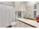 Clean bathroom with white cabinets and a herringbone shower curtain at 3427 Colonel Vanderhorst Cir, Mount Pleasant, SC 29466