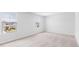 Bright bedroom with neutral carpeting and two large windows at 361 Willows Crescent Dr, Moncks Corner, SC 29461