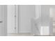 Upstairs hallway with neutral walls and carpet, showing access to bedrooms and bathroom at 361 Willows Crescent Dr, Moncks Corner, SC 29461