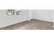 Bright bedroom with wood-look flooring and a window overlooking the neighborhood at 361 Willows Crescent Dr, Moncks Corner, SC 29461
