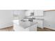 Modern kitchen with white cabinets, granite countertops, and stainless steel appliances at 361 Willows Crescent Dr, Moncks Corner, SC 29461