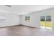 Bright living room featuring hardwood floors and sliding glass doors leading to backyard at 361 Willows Crescent Dr, Moncks Corner, SC 29461