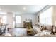 Open living room with neutral decor and hardwood floors at 353 Willows Crescent Way, Moncks Corner, SC 29461