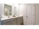 Bathroom with double vanity, large mirror, and ample storage at 353 Willows Crescent Way, Moncks Corner, SC 29461