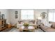 Living room features a light neutral couch and wood coffee table at 353 Willows Crescent Way, Moncks Corner, SC 29461