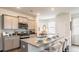 Open kitchen with granite countertops and stainless steel appliances at 353 Willows Crescent Way, Moncks Corner, SC 29461