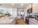 Open kitchen with granite countertops and stainless steel appliances at 353 Willows Crescent Way, Moncks Corner, SC 29461