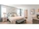 Spacious main bedroom with a plush bed and plenty of natural light at 353 Willows Crescent Way, Moncks Corner, SC 29461