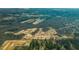 An aerial view shows a residential community adjacent to a large forest, offering serene natural surroundings at 373 Willows Crescent Dr, Moncks Corner, SC 29461