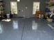 Large garage with epoxy flooring, ample storage shelving, and space for multiple vehicles at 174 Whaler Ave, Summerville, SC 29486