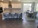Modern kitchen with white cabinets, granite countertops, and an island at 174 Whaler Ave, Summerville, SC 29486