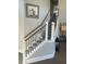 Elegant staircase with a wood and metal railing at 174 Whaler Ave, Summerville, SC 29486
