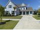 Two-story home with gray siding, white trim, and a large front porch at 174 Whaler Ave, Summerville, SC 29486