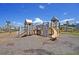 Community playground with wooden play structures, slide, and climbing features at 174 Whaler Ave, Summerville, SC 29486