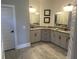 Elegant bathroom with double vanity, granite countertops, and tile flooring at 174 Whaler Ave, Summerville, SC 29486