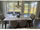 Bright dining room features a marble table with seating for six and views of the water at 174 Whaler Ave, Summerville, SC 29486
