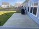 Spacious concrete patio, perfect for outdoor grilling and entertaining, overlooks a fenced backyard at 174 Whaler Ave, Summerville, SC 29486
