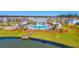 Community pool with a surrounding deck and lounge area, near a pond at 174 Whaler Ave, Summerville, SC 29486