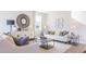 Spacious living room with comfortable seating and large mirror at 150 Carolina Groves Blvd, Moncks Corner, SC 29461