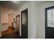 Laundry room with dark door and tiled floor at 316 Haynes St, Walterboro, SC 29488