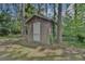 Rustic wooden shed nestled among tall pines at 316 Haynes St, Walterboro, SC 29488