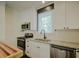 White cabinets and granite countertops in kitchen at 316 Haynes St, Walterboro, SC 29488