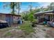 View of a cluttered backyard with sheds and outbuildings at 316 Haynes St, Walterboro, SC 29488