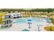 Aerial view of the community pool area, including a lap pool and playground at 518 Golden Embers Way, Summerville, SC 29486