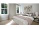 Spacious main bedroom with plush bedding and large windows at 102 East Morton St, Summerville, SC 29486