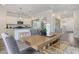 Modern dining room with adjacent kitchen and hardwood floors at 359 Gothenburg Trl, Summerville, SC 29486