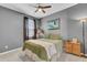 Bedroom with gray walls, ceiling fan, and a comfortable bed at 182 Greenwich Dr, Summerville, SC 29486