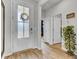 Light and airy entryway with hardwood floors, and access to other rooms at 182 Greenwich Dr, Summerville, SC 29486