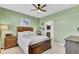 Bedroom with wood bed frame, green walls, and ample natural light at 182 Greenwich Dr, Summerville, SC 29486