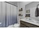 Small bathroom with shower/tub combo, vanity, and floating shelves at 182 Greenwich Dr, Summerville, SC 29486